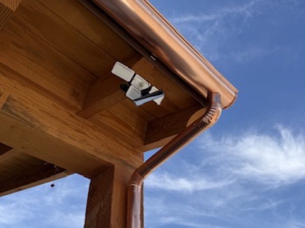 City Seamless rain gutter downspout installation detail.