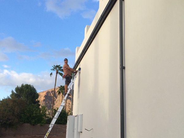 City Seamless rain gutter installation crew and equipment photo.