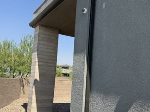 City Seamless straight-face gutter with downspout routing on a modern roofline.