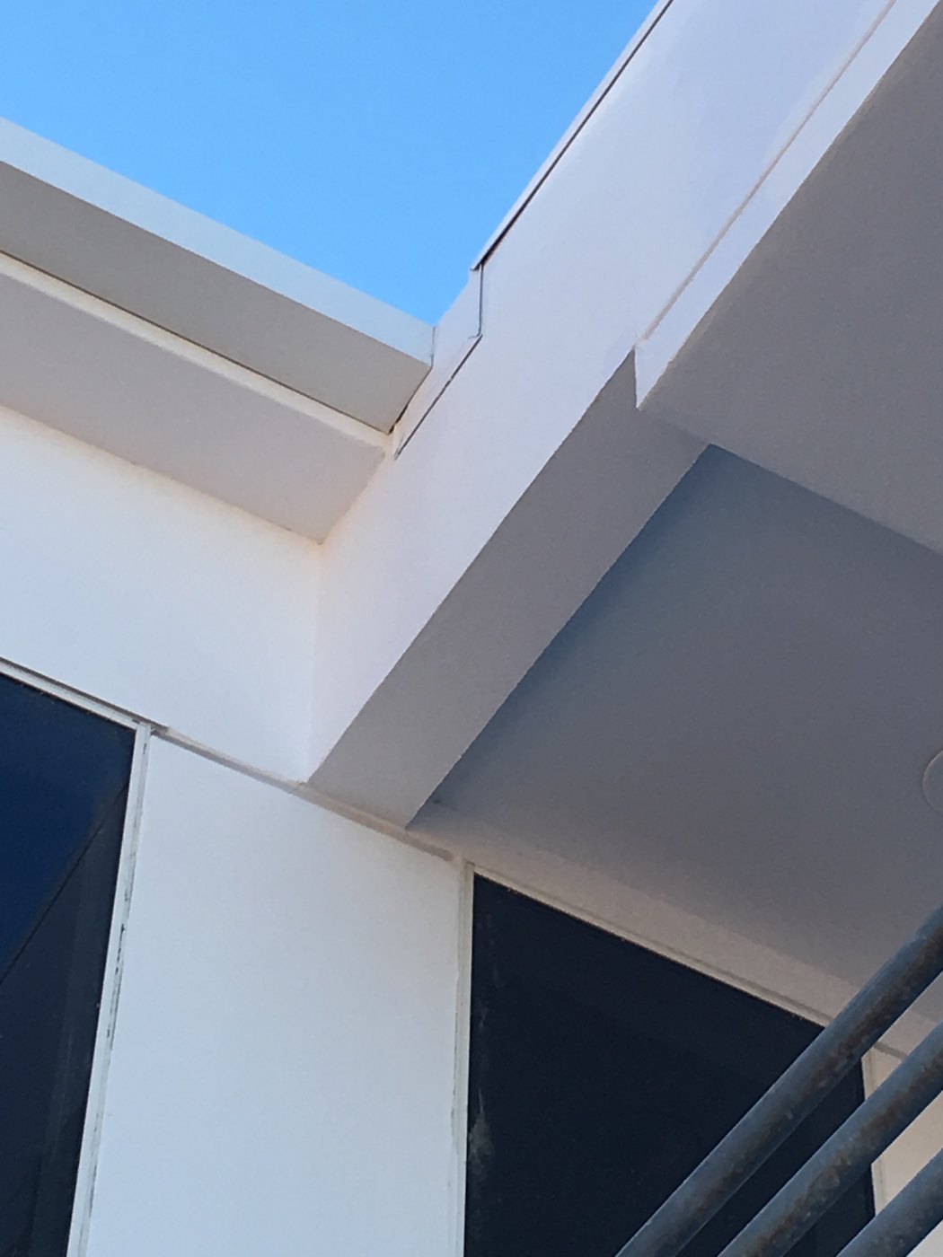 Seamless rain gutter corner detail under a soffit