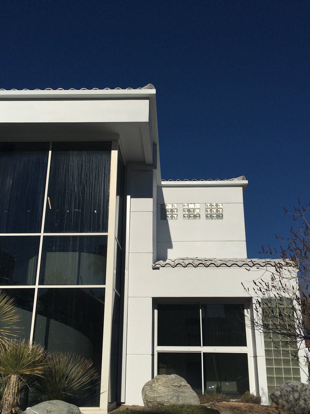 White home with rain gutter installation